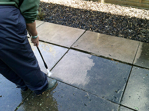 Pressure washing of hard surfaces